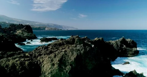 4k Slowmotion drone shot of powerful ocean waves crashing rocks in Tenerife Stock Footage 90289222