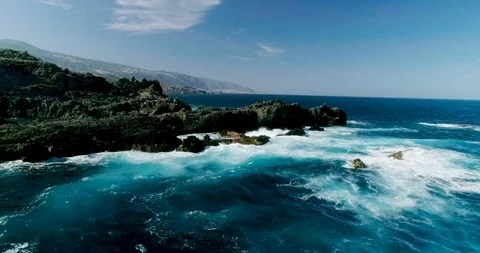 4k Slowmotion drone shot of powerful ocean waves crashing rocks in Tenerife Stock Footage 90289770