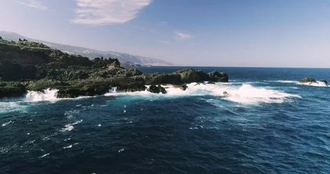 4k Slowmotion drone shot of powerful ocean waves crashing rocks in Tenerife Stock Footage 90290357