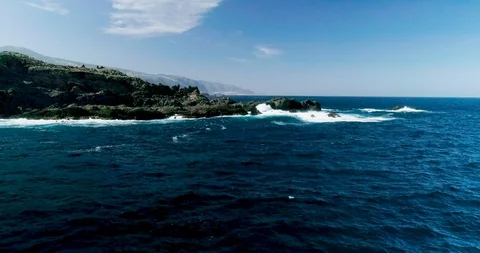 4k Slowmotion drone shot of powerful ocean waves crashing rocks in Tenerife Stock Footage 90291100
