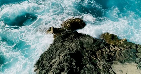 4k Slowmotion drone shot of powerful ocean waves crashing rocks in Tenerife Stock Footage 90291540