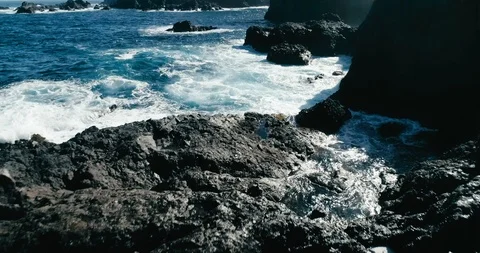 4k Slowmotion drone shot of powerful ocean waves crashing rocks in Tenerife Stock Footage 90303058