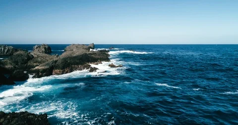 4k Slowmotion drone shot of powerful ocean waves crashing rocks in Tenerife Stock Footage 90303166