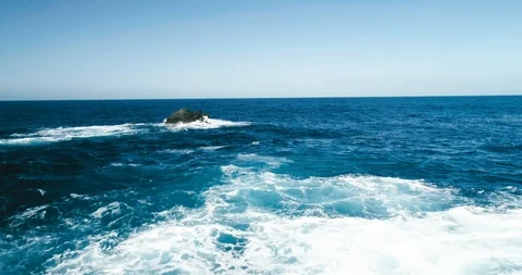 4k Slowmotion drone shot of powerful ocean waves crashing rocks in Tenerife Stock Footage 90303283