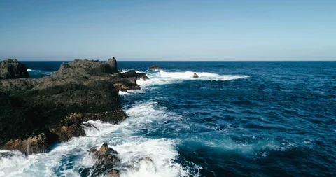 4k Slowmotion drone shot of powerful ocean waves crashing rocks in Tenerife 스톡 동영상 90303369