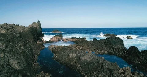 4k Slowmotion drone shot of powerful ocean waves crashing rocks in Tenerife Stock Footage 90303489