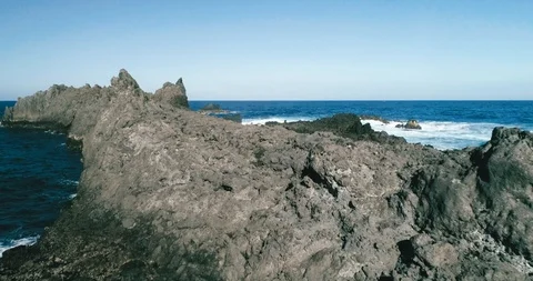 4k Slowmotion drone shot of powerful ocean waves crashing rocks in Tenerife 스톡 동영상 90303629