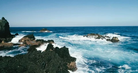 4k Slowmotion drone shot of powerful ocean waves crashing rocks in Tenerife Stock Footage 90303742