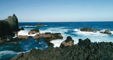 4k Slowmotion drone shot of powerful ocean waves crashing rocks in Tenerife Stock Footage 90303766