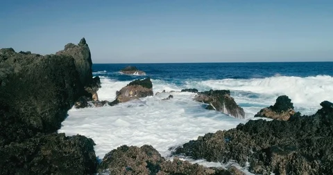 4k Slowmotion drone shot of powerful ocean waves crashing rocks in Tenerife Stock Footage 90304182