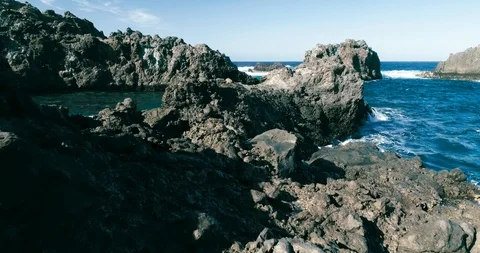 4k Slowmotion drone shot of powerful ocean waves crashing rocks in Tenerife Stock Footage 90304227