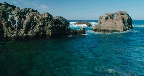 4k Slowmotion drone shot of powerful ocean waves crashing rocks in Tenerife Stock Footage 90304466