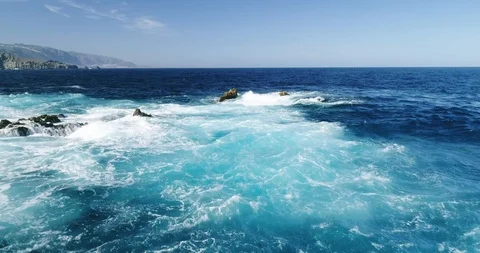 4k Slowmotion drone shot of powerful ocean waves crashing rocks in Tenerife Stock Footage 90304616