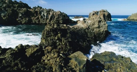 4k Slowmotion drone shot of powerful ocean waves crashing rocks in Tenerife Video stock 90304678