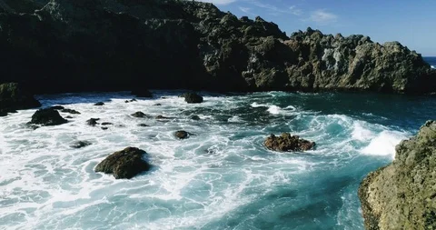 4k Slowmotion drone shot of powerful ocean waves crashing rocks in Tenerife Stock Footage 90304818