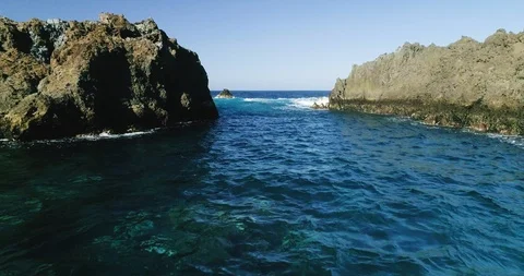 4k Slowmotion drone shot of powerful ocean waves crashing rocks in Tenerife Stock Footage 90305541