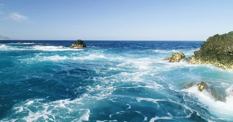 4k Slowmotion drone shot of powerful ocean waves crashing rocks in Tenerife Stock Footage 90305917