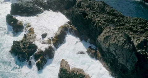 4k Slowmotion drone shot of powerful ocean waves crashing rocks in Tenerife Stock Footage 90306436