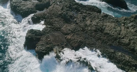 4k Slowmotion drone shot of powerful ocean waves crashing rocks in Tenerife Stock Footage 90306514