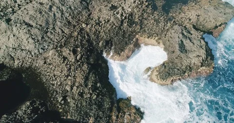 4k Slowmotion drone shot of powerful ocean waves crashing rocks in Tenerife Video stock 90306605