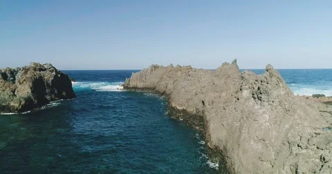 4k Slowmotion drone shot of powerful ocean waves crashing rocks in Tenerife Stock Footage 90306863