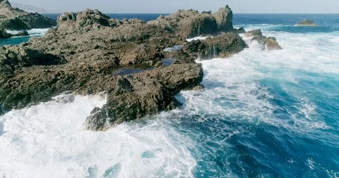 4k Slowmotion drone shot of powerful ocean waves crashing rocks in Tenerife Stock Footage 90308068