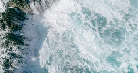 4k Slowmotion drone shot of powerful ocean waves crashing rocks in Tenerife Stock Footage 90308353