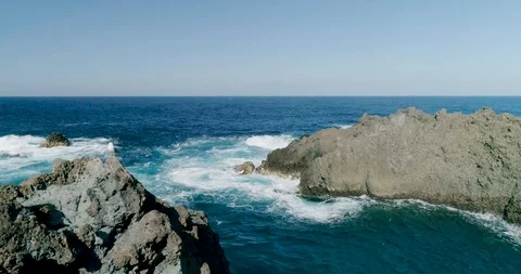 4k Slowmotion drone shot of powerful ocean waves crashing rocks in Tenerife Stock-Footage 90308810