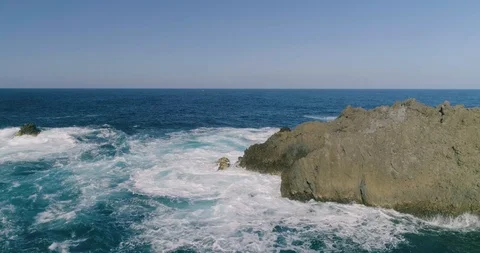 4k Slowmotion drone shot of powerful ocean waves crashing rocks in Tenerife Stock Footage 90308888