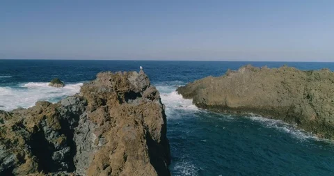 4k Slowmotion drone shot of powerful ocean waves crashing rocks in Tenerife Stock Footage 90308904