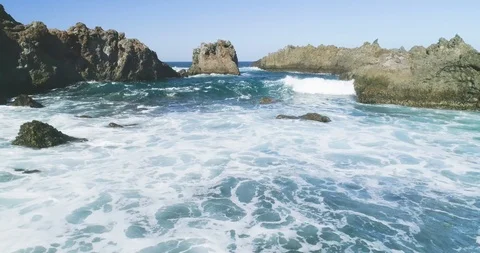4k Slowmotion drone shot of powerful ocean waves crashing rocks in Tenerife Video stock 90308950