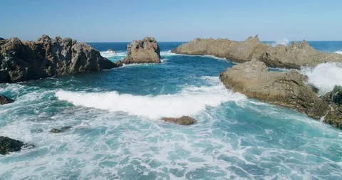 4k Slowmotion drone shot of powerful ocean waves crashing rocks in Tenerife Stock Footage 90309172