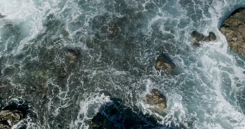 4k Slowmotion drone shot of powerful ocean waves crashing rocks in Tenerife Stock Footage 90309181