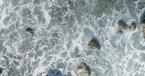 4k Slowmotion drone shot of powerful ocean waves crashing rocks in Tenerife Stock Footage 90309236