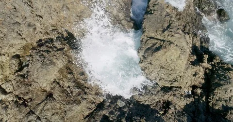 4k Slowmotion drone shot of powerful ocean waves crashing rocks in Tenerife Stock Footage 90309452