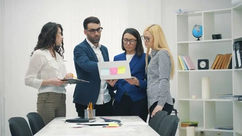 4k slowmotion video of workers making decision together. Stock Footage 137809770