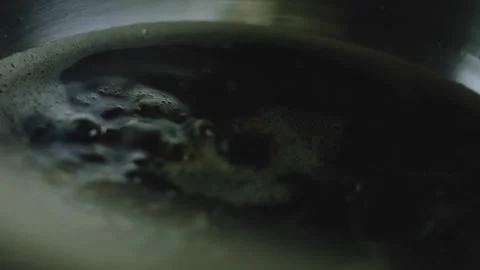 4K Small Bubbles Forming in a Dark Cola Reduction Video stock 342112920