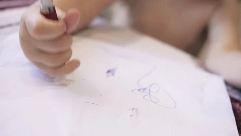 4K small child draws with a pen, close up Stock Footage 110872692