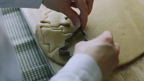 4K Small Christmas Cutter Pressed into Rolled Gingerbread Dough Stock Footage 342113415