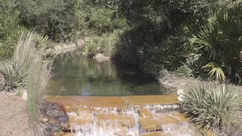 4K Small Flowing Creek Down Small Waterfall Stock-Footage 123087029