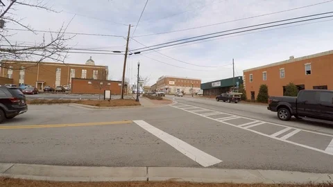 4k-Small Town Traffic With Traffic Stop In Back Ground Stock Footage 102955704