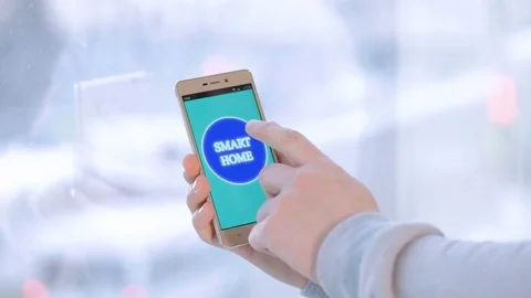 4K. Smarthome system. Hands with a smartphone with a fictional screen interface Stock Footage 74574035