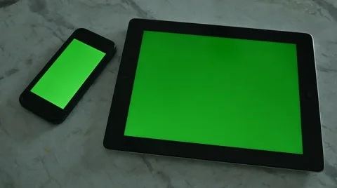 4K SMARTPHONE AND TABLET WITH GREEN SCREEN ON MARBLE Stock Footage 45203497
