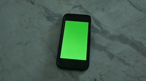 4K SMARTPHONE WITH GREEN SCREEN ON MARBLE Stock Footage 45203517