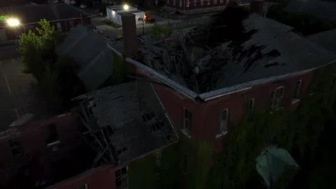4K Smooth Drone Dolly-Out Reveal of Collapsed Roof on Condemned Building Aerial Stock Footage 165089950