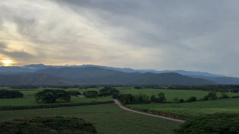 4K Smooth Panning Shot Left to Right Revealing Golden Hour Sunset Over Colombian Stock Footage 340938925