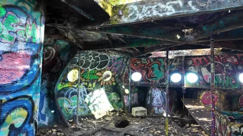 4K smooth walk through abandoned UFO-like graffiti structure near Collins Beach  Stock Footage 318636736