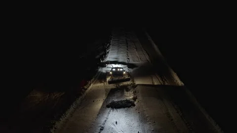4k. Snow grooming machine on a ski slope at night Stock Footage 161258018