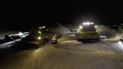 4k. Snow grooming machine on a ski slope at night Stock Footage 161259546