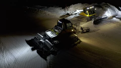 4k. Snow grooming machine on a ski slope at night Stock Footage 161259869